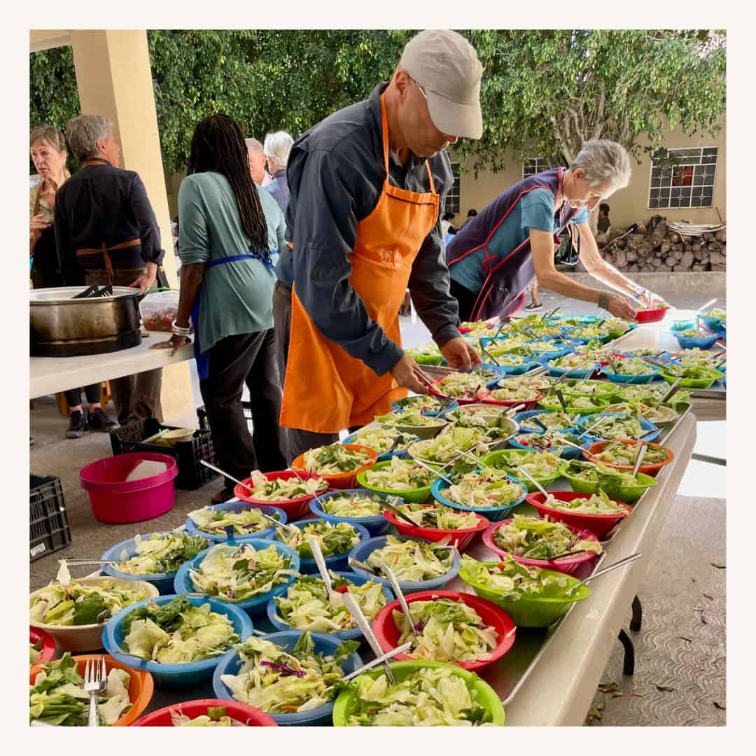 Healthy salad bar with fresh vegetables at community gathering, featuring a SMCF Nonprofit Network Member organization.